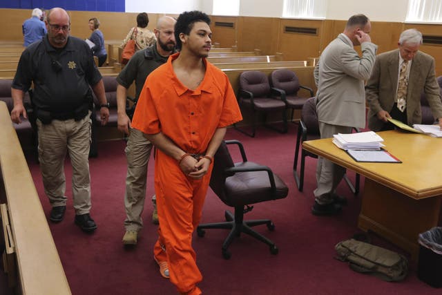 Jorge "Lumni" Sanders-Galvez, one of two men accused of killing Kedarie Johnson, 16, exits the courtroom following a hearing for his murder trial at the Des Moines County Courthouse in Burlington, Iowa