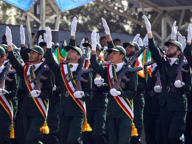 <p>Iranian elite revolutionary guards march during an annual military parade </p>