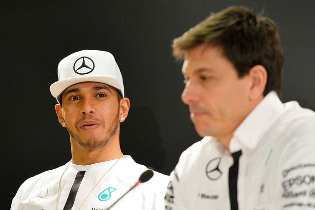 Lewis Hamilton (left) with Toto Wolff, Mercedes' team principal