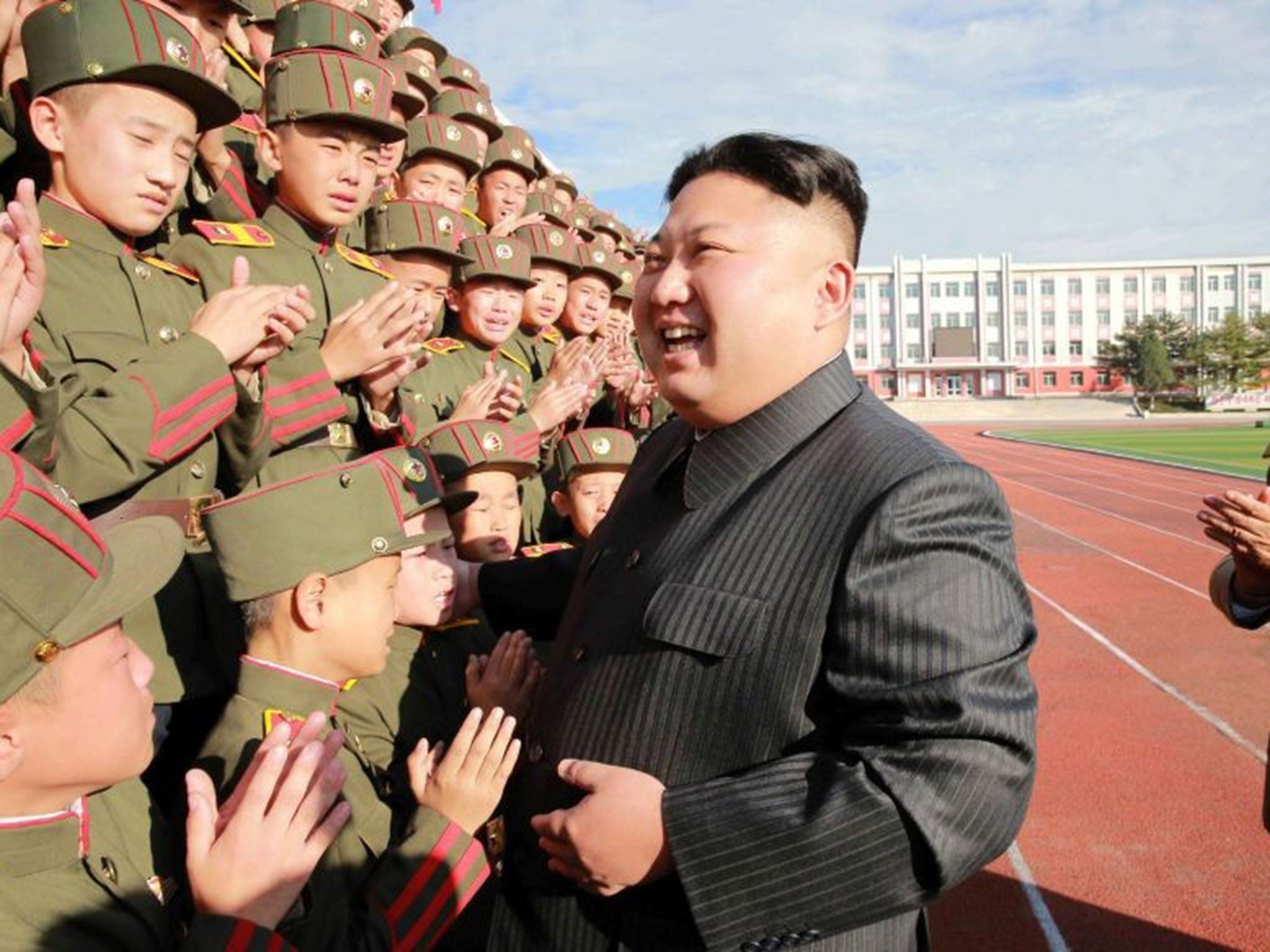Kim Jong Un with members of the North Korean Army. The army controls the research centre where it is believed biological weapons are developed