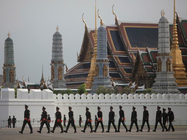 Police patrol outside the Grand Palace in Bangkok where the late king’s body is enshrined