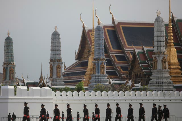 Police patrol outside the Grand Palace in Bangkok where the late king’s body is enshrined