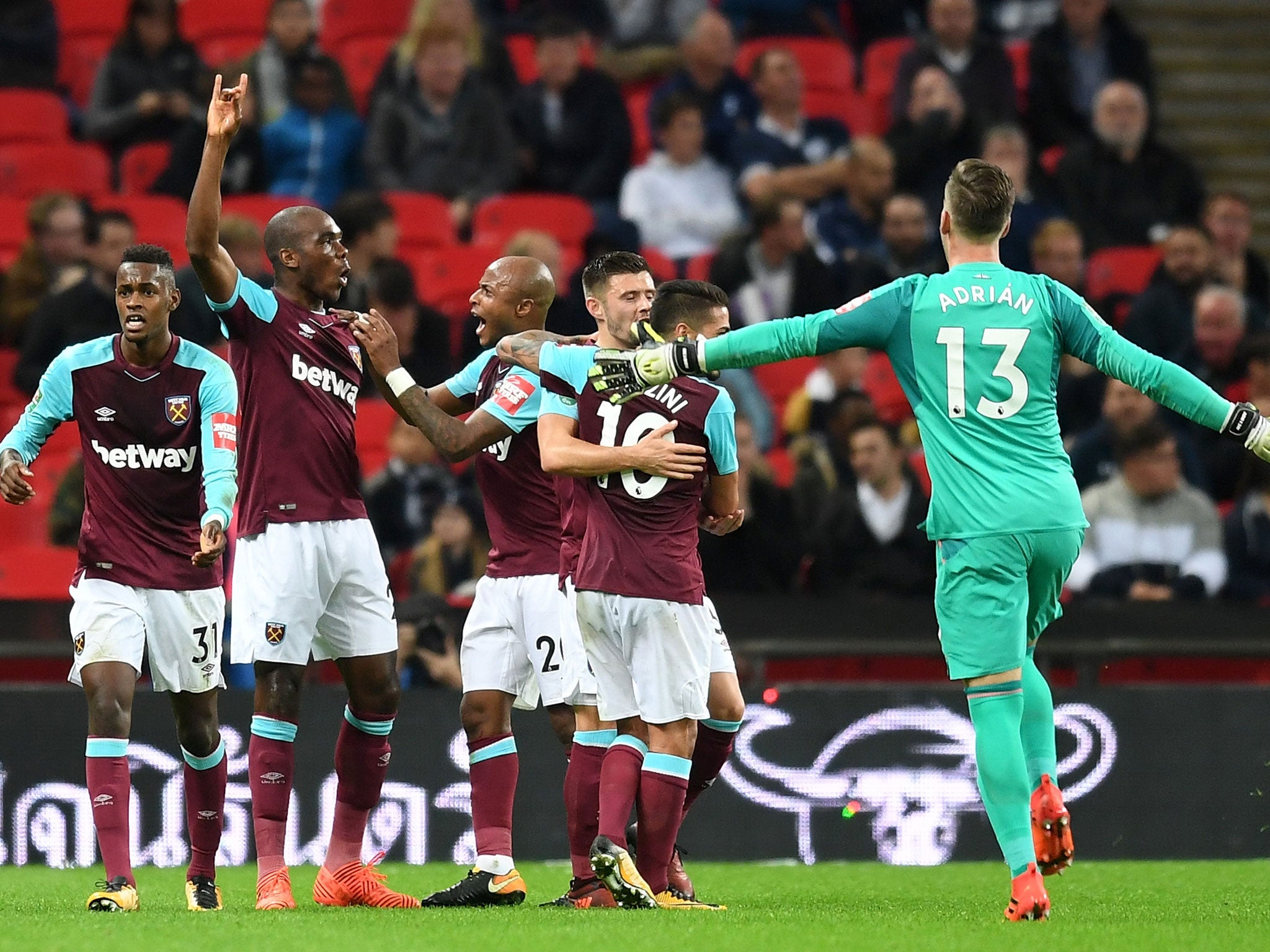 West Ham's players celebrate with Angelo Ogbonna after the Italian put his side ahead
