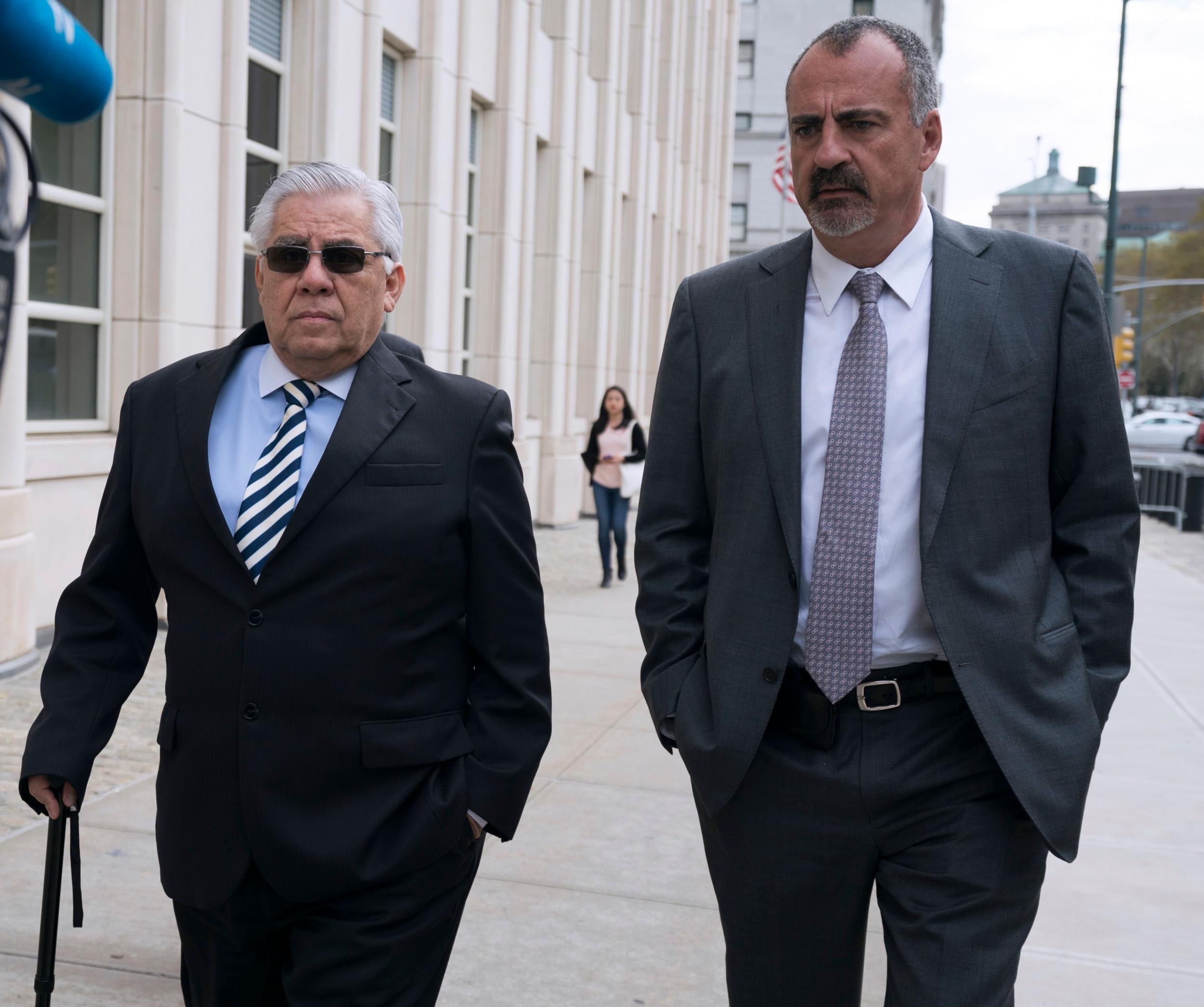 Trujillo, at left, arriving at a federal courthouse in New York City for sentencing