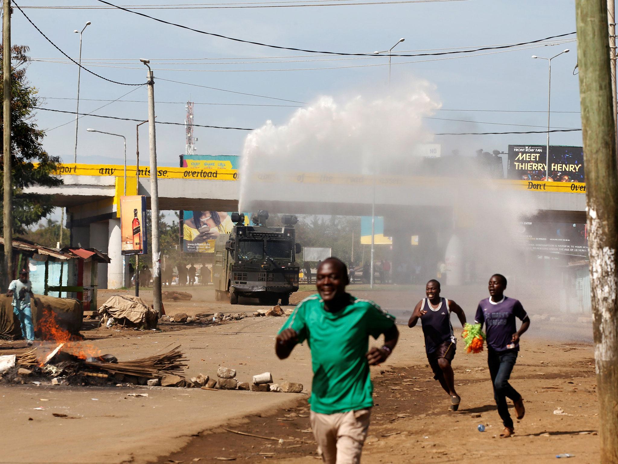 Kenyan anti-riot police deploy a water cannon during clashes with supporters of Kenyan opposition leader Raila Odinga in Kisumu