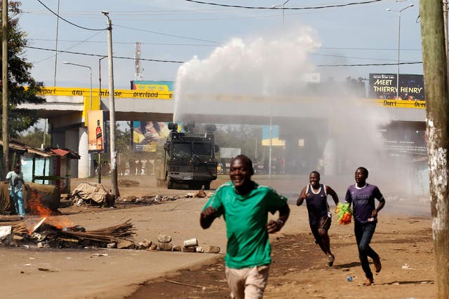 Kenyan anti-riot police deploy a water cannon during clashes with supporters of Kenyan opposition leader Raila Odinga in Kisumu