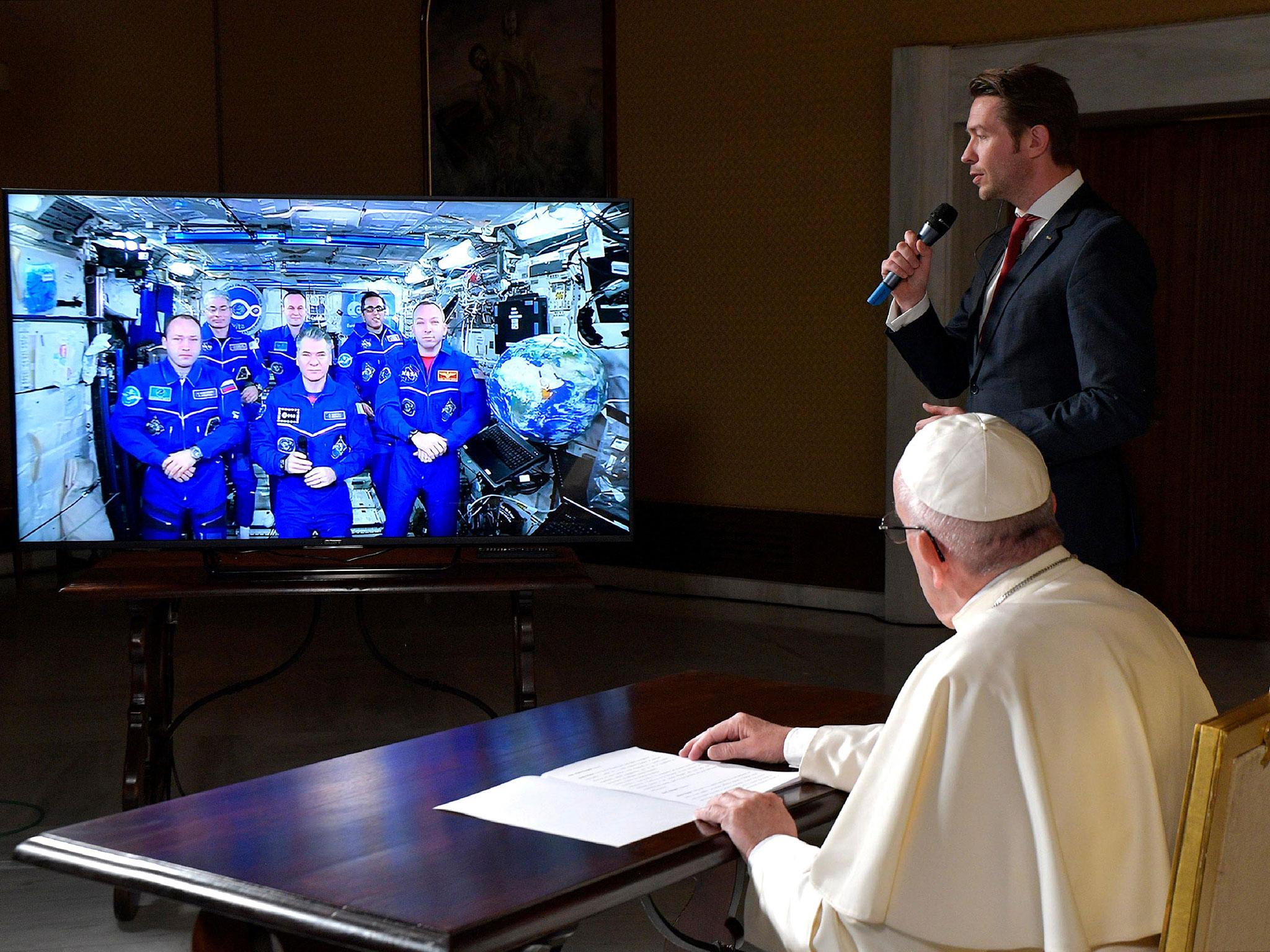 Pope Francis attends an audio-video connection with crew members of the International Space Station, ISS Expedition 53, at the Vatican