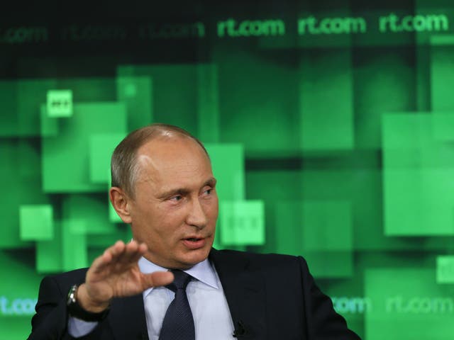 Russian President Vladimir Putin speaks during his visit to the new studio complex of Russia Today in Moscow on June 11, 2013