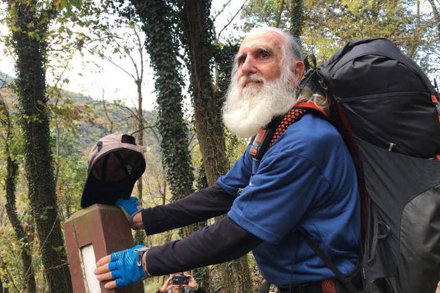 Dale Sanders, 82, stopped to kiss his last trail marker before becoming the oldest person to hike all 2,190 miles of the Appalachian Trail within a year.