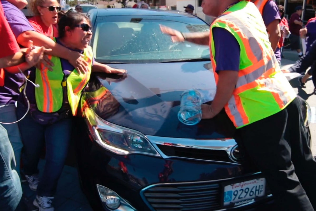 Man drives car into crowd protesting Trump immigration policy | The ...