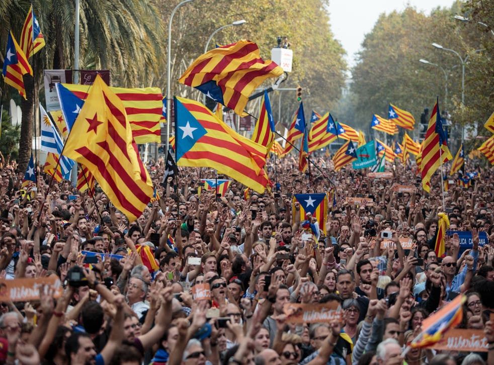 Supporters of Catalan independence react to news that the Catalan parliament has declared independence