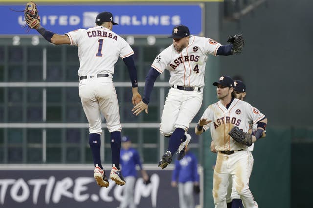 Houston Astros' Carlos Correa and George Springer celebrate winning Game 3 of the World Series