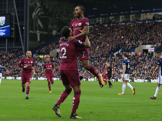 Raheem Sterling celebrates adding Manchester City's third
