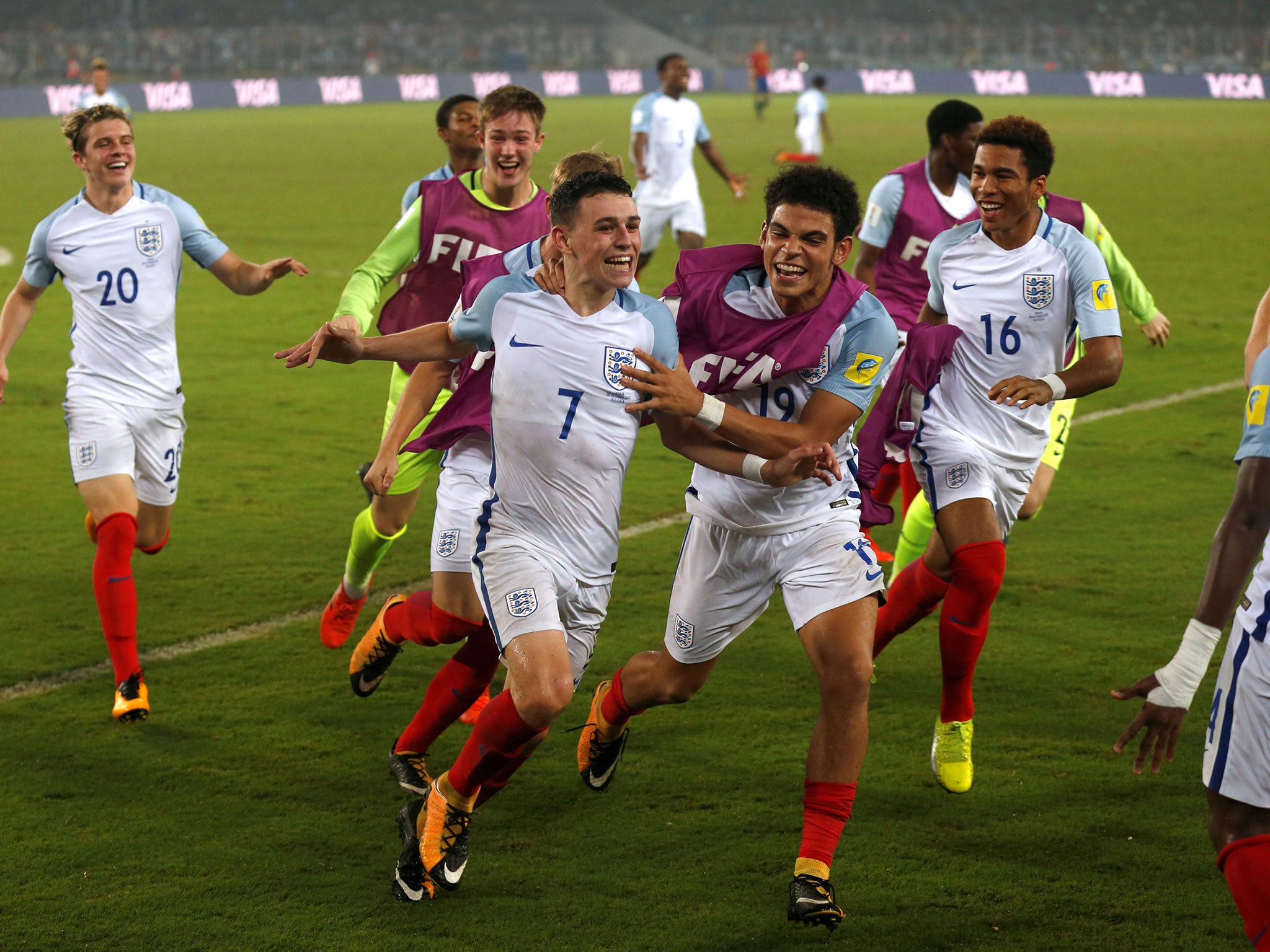 Philip Foden celebrates with his teammates after scoring England's fifth