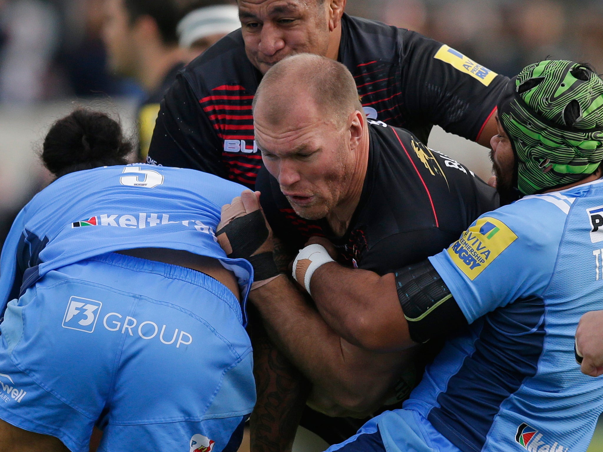 Schalk Burger is tackled during Saracens' win over London Irish