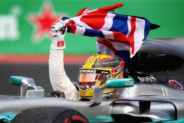Hamilton celebrates his success from the cockpit of his championship-winning Mercedes