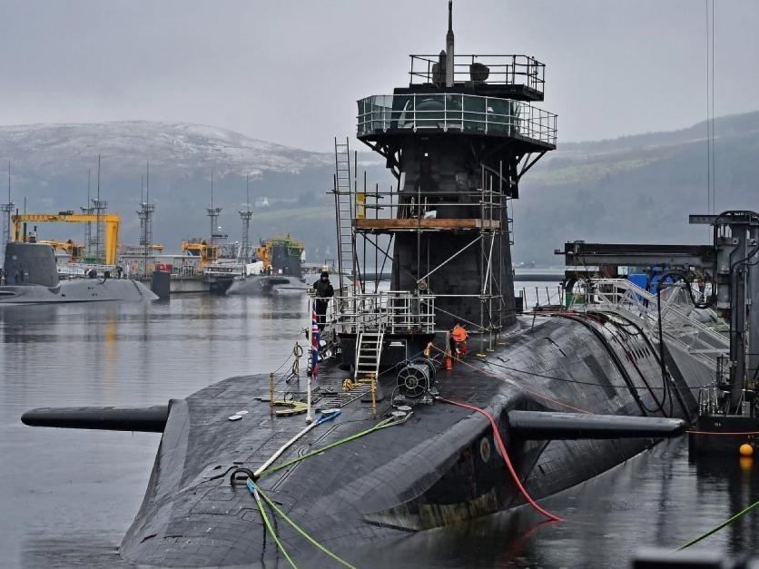 Royal Navy security personnel stand guard on HMS Vigilant at Her Majesty’s Naval Base, Clyde, Scotland, in 2016