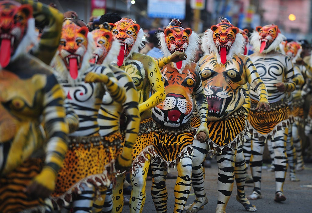 Indian performers take part in the ‘Pulikali’, or Tiger Dance, in Thrissur