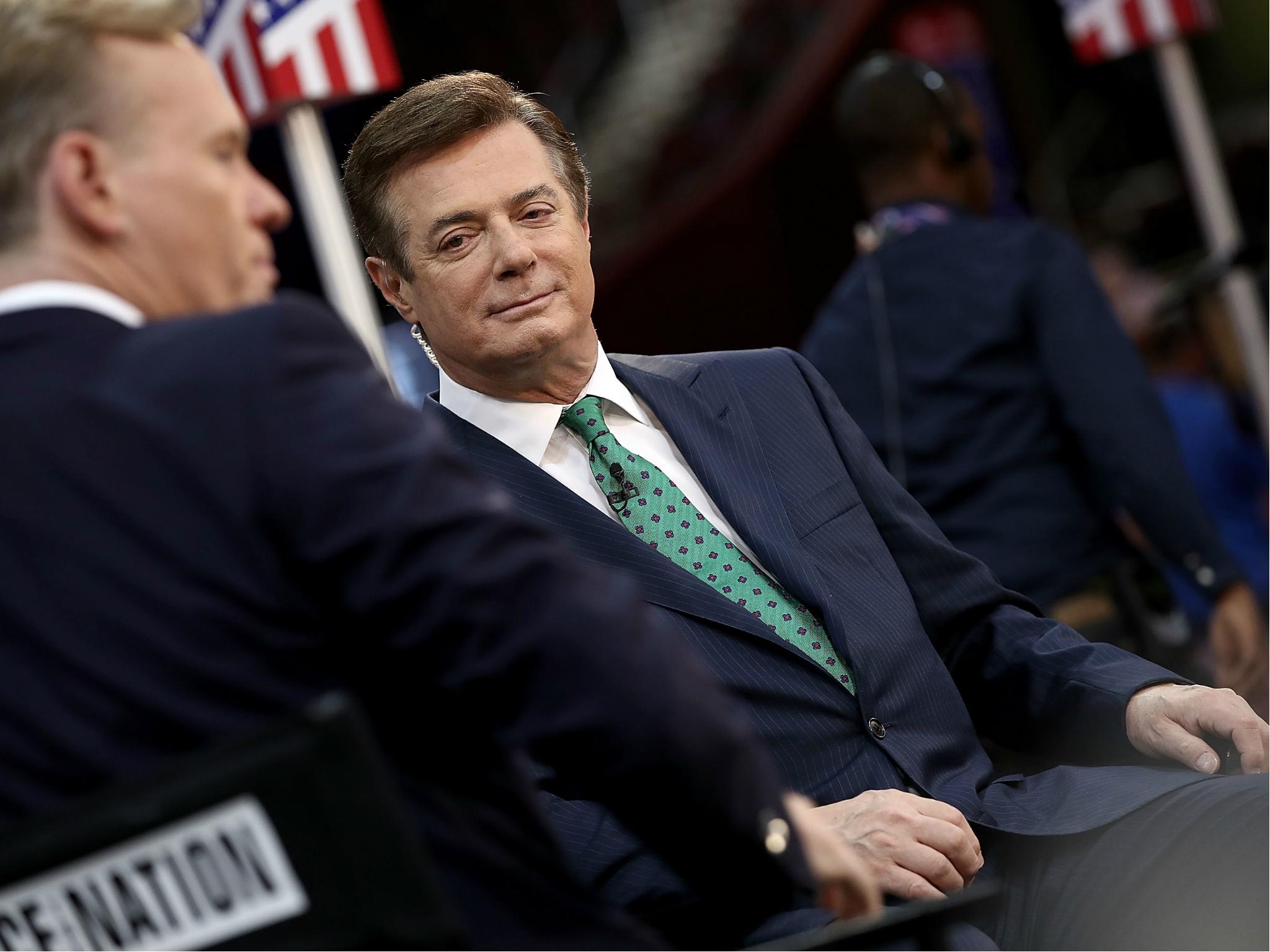 Paul Manafort, former campaign manager for President Donald Trump, is interviewed on the floor of the Republican National Convention 17 July 2016.