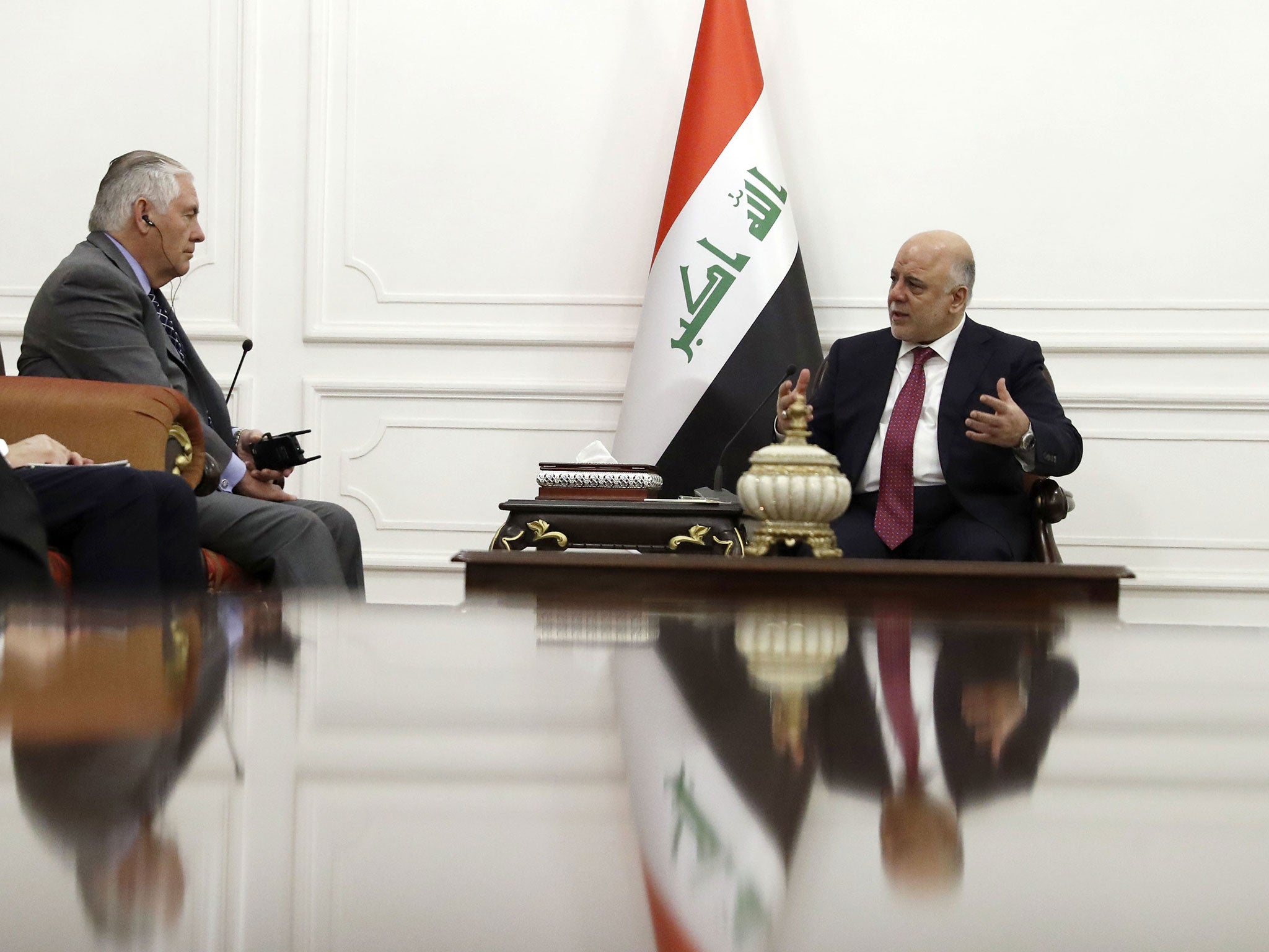 The Iraqi Prime Minister Haider al-Abadi (right), pictured here during a meeting with the US's Rex Tillerson, has emerged with his reputation buoyed after successes over Isis and the Kurds