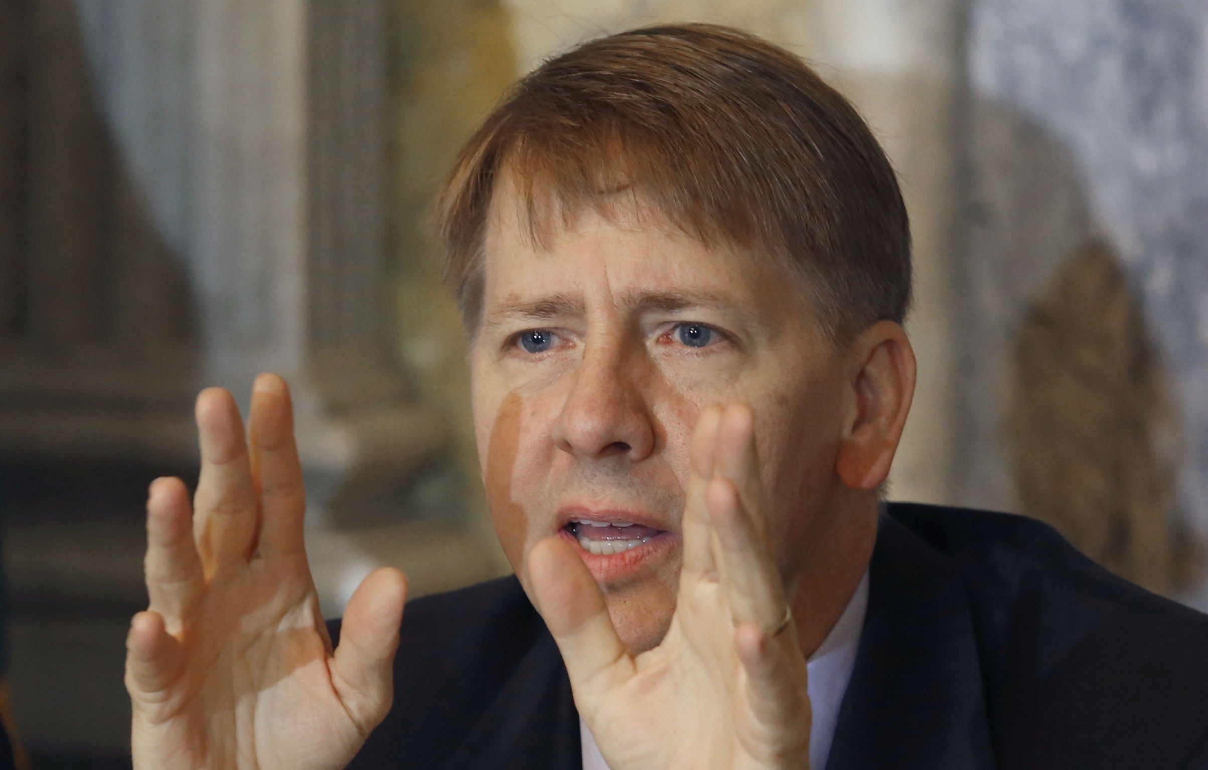 Consumer Financial Protection Bureau director Richard Cordray, seen here at the Treasury Department in Washington on October 2, 2014, urged Donald Trump to not let Americans 'get cheated out of their hard-earned money'