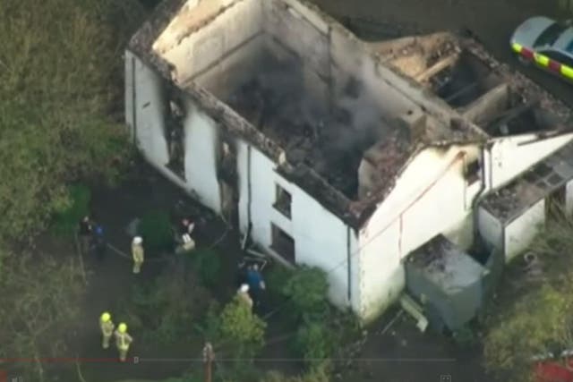 Aerial footage of the remains of the remains of the farmhouse at Llangammarch Wells, Powys, following the blaze at the remote property
