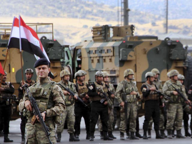 Turkish and Iraqi troops participate in a ceremony at the Habur-Ibrahim Khalil border crossing