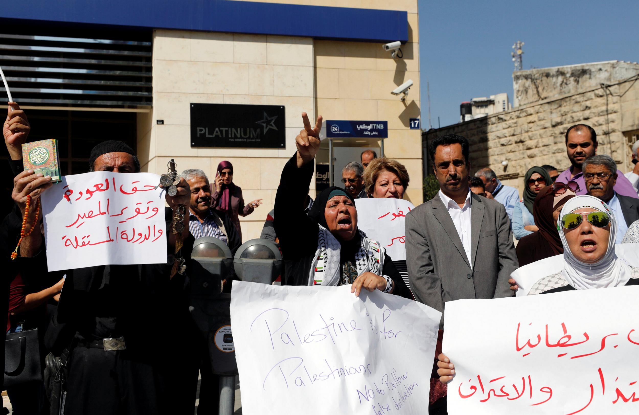 Palestinians take part in a protest calling on Britain to apologise for the Balfour Declaration in the West Bank city of Ramallah on 18 October 2017