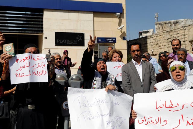 Palestinians take part in a protest calling on Britain to apologise for the Balfour Declaration in the West Bank city of Ramallah on 18 October 2017