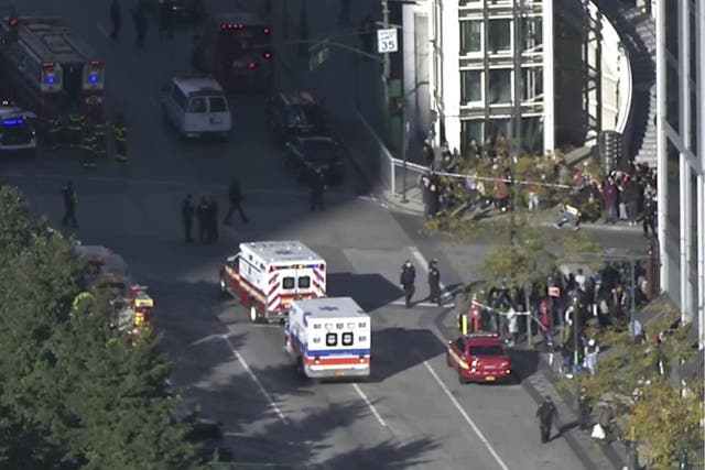 In this still image taken from video, police and ambulances respond to report of gunfire a few blocks from the World Trade Center in New York on 31 October 2017