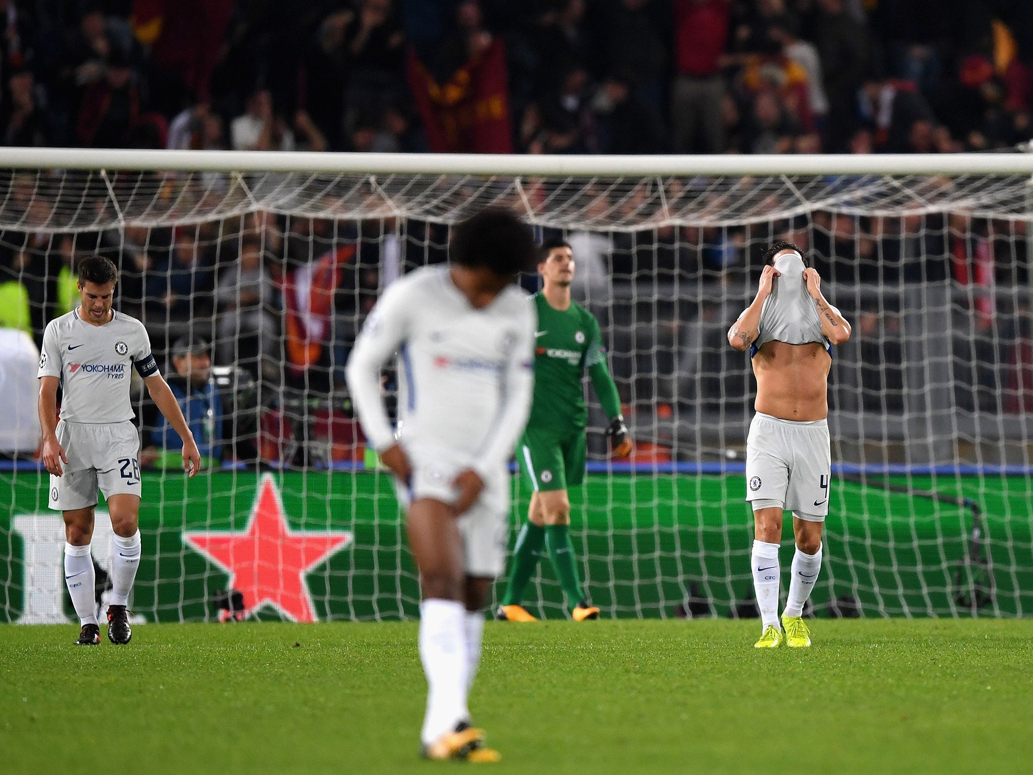 Chelsea's players react after conceding their third goal of the night