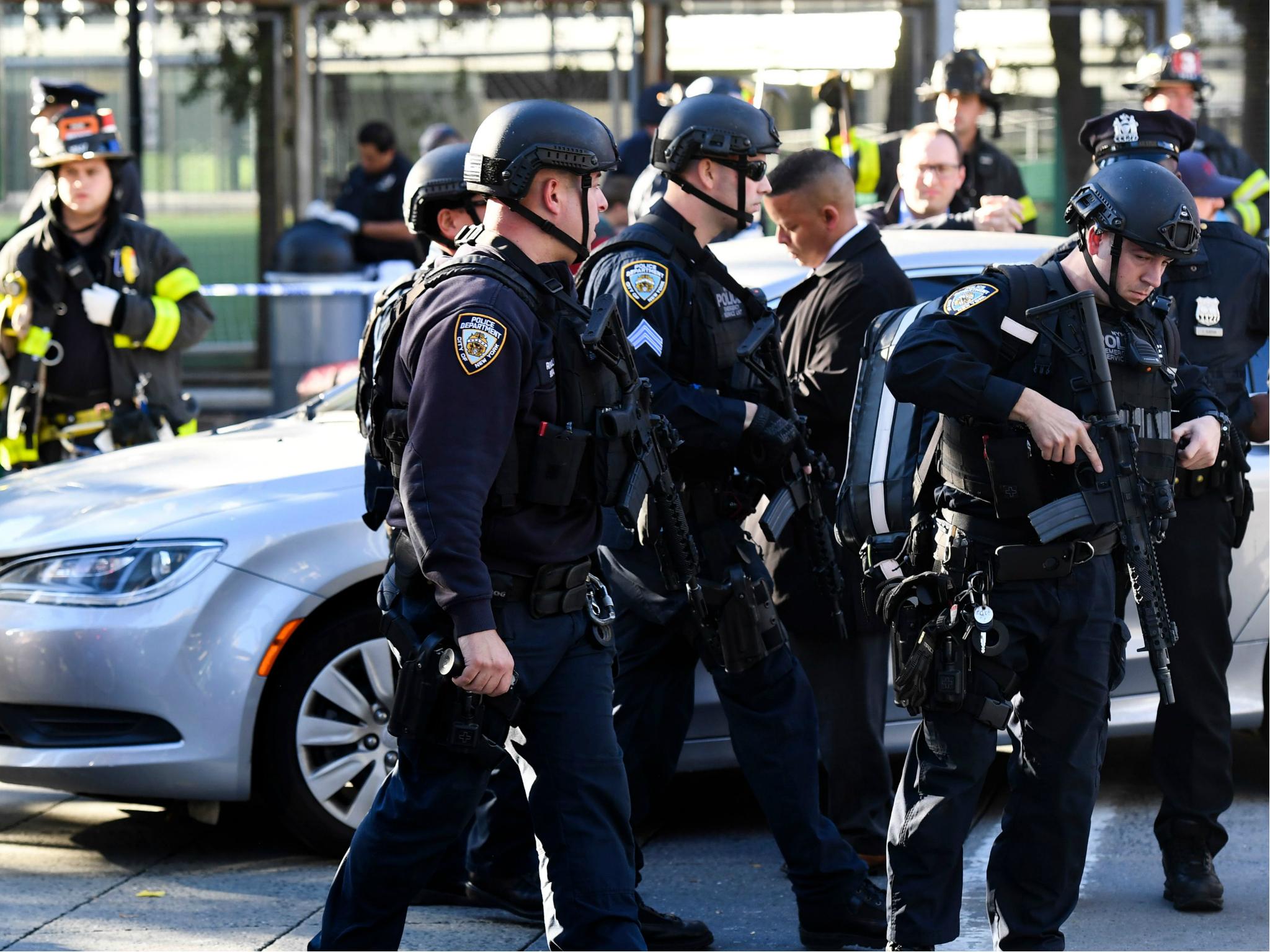 Police officers arrive at the scene following the truck attack in New York
