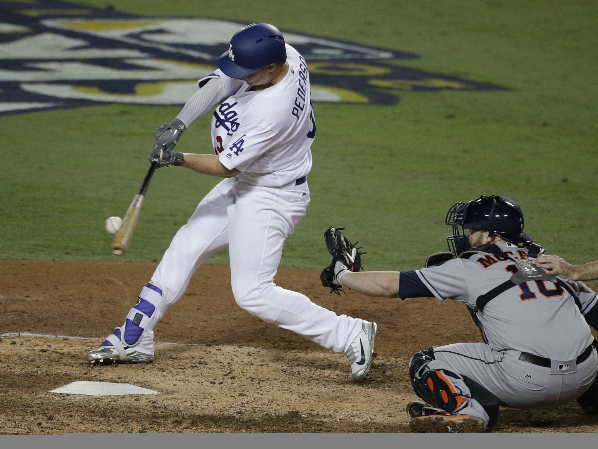 Los Angeles Dodgers' Joc Pederson hits a home run against the Houston Astros during the seventh inning