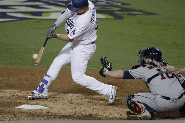 Los Angeles Dodgers' Joc Pederson hits a home run against the Houston Astros during the seventh inning