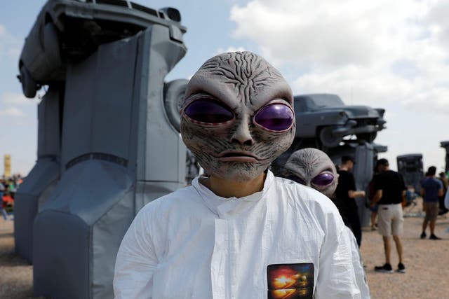 Meagan Shrewsbury and Kim Galyen dress as aliens during the solar eclipse