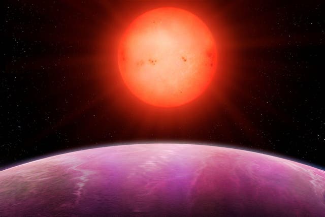 An artist's impression of a planet orbiting a red dwarf star