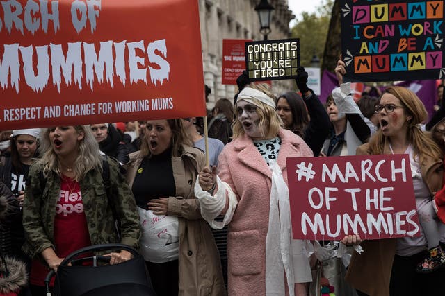 Women protest outside Downing Street as they join a demonstration demanding rights for working mothers