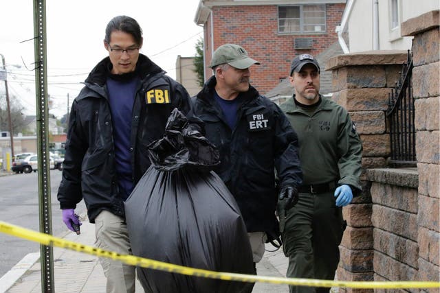 FBI officers walk outside of suspect terrorist Sayfullah Saipovs apartment, on 1 November 2017, in Paterson, New Jersey.