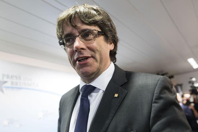 Dismissed Catalan regional President Carles Puigdemont attends a press conference at International Press Club of Brussels
