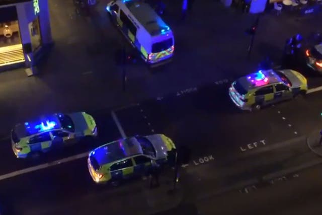 Police at the scene near the Strand in central London after a cab crashed into pedestrians
