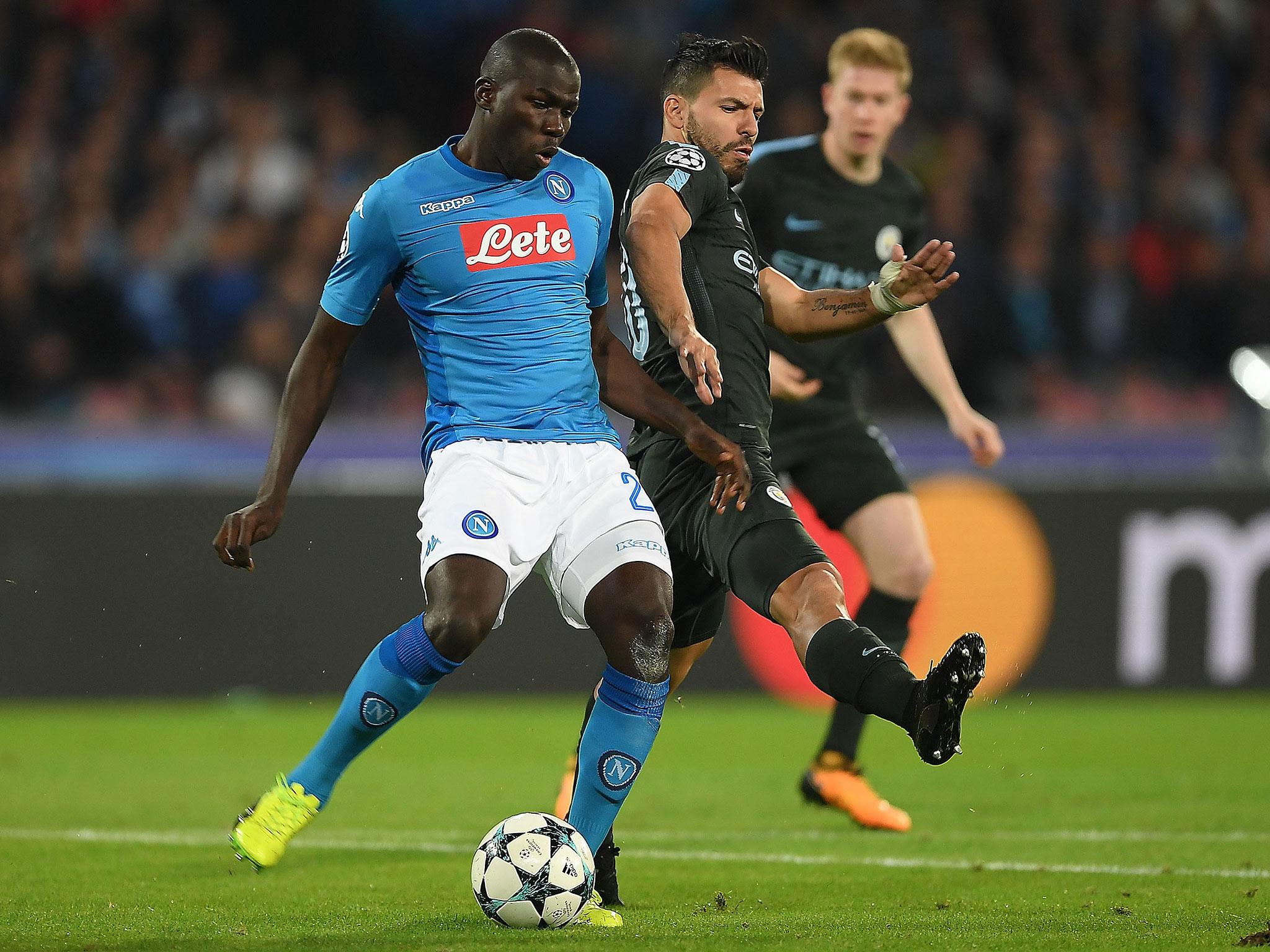 Sergio Aguero attempts to stop Kalidou Koulibaly from playing a pass