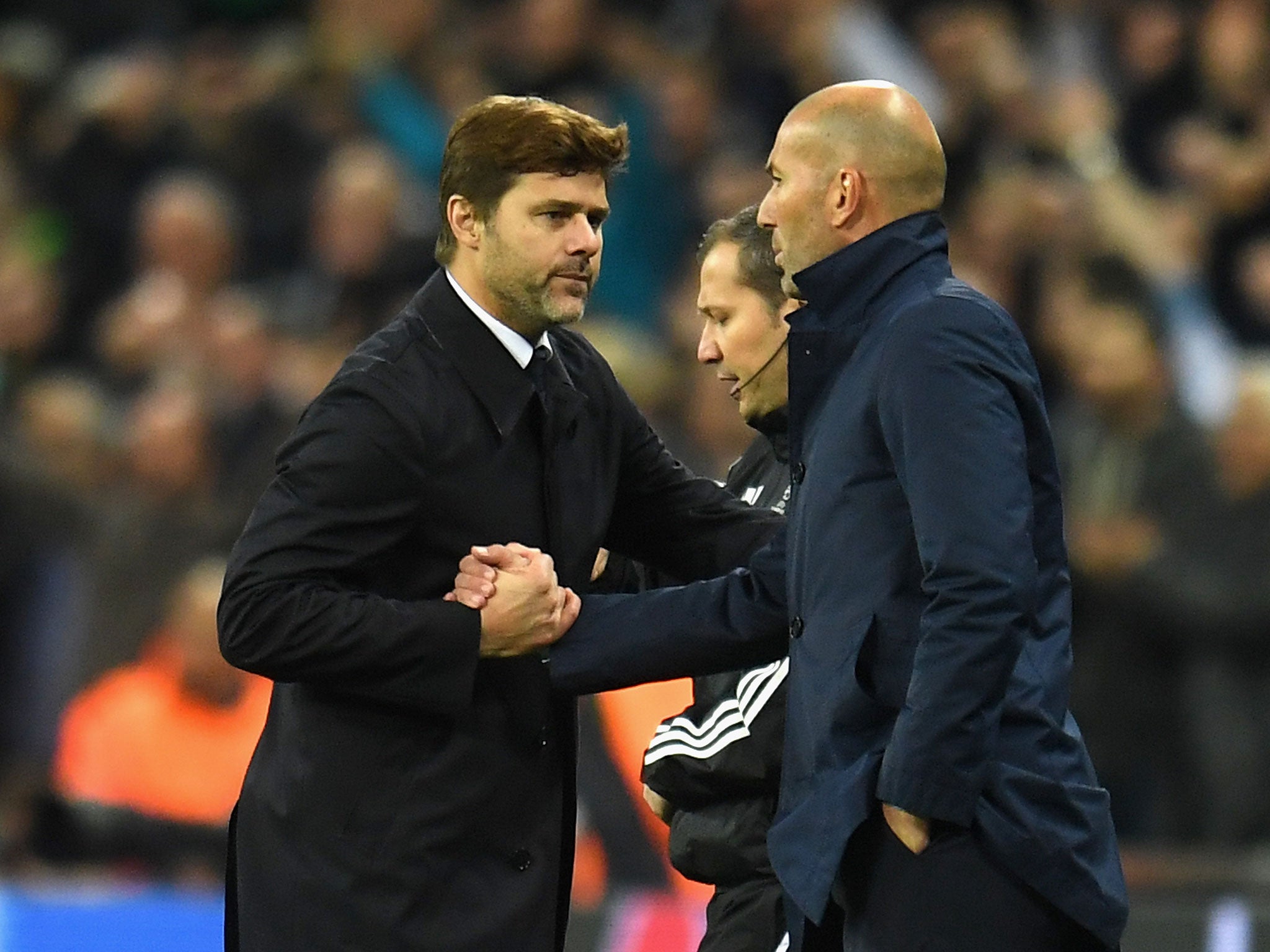Mauricio Pochettino with Real Madrid manager Zinedine Zidane after the final whistle at Wembley