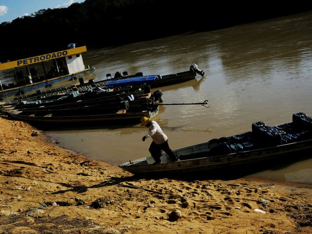 A man exits a canoe in Brazil's Para state, where the Heart family disappeared