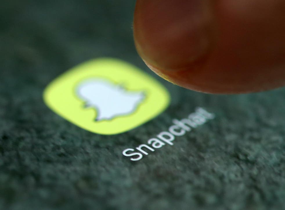 The Snapchat app logo is seen on a smartphone in this picture illustration taken September 15, 2017