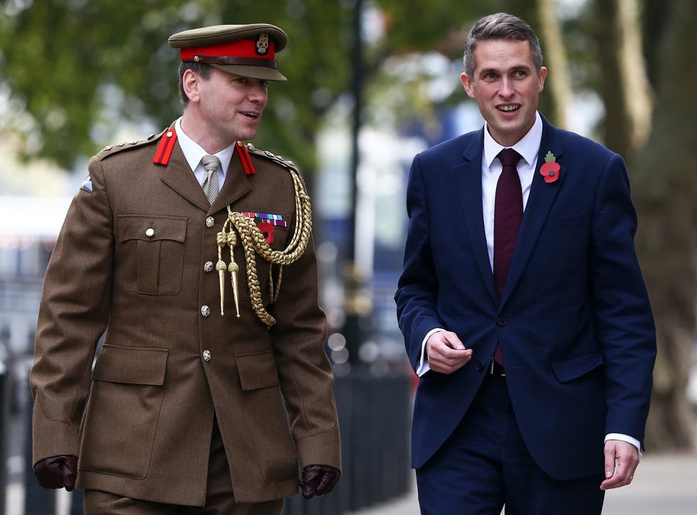Gavin Williamson arrives at the British Ministry of Defence, with Colonel John Clark, after being announced as the new Defence Secretary
