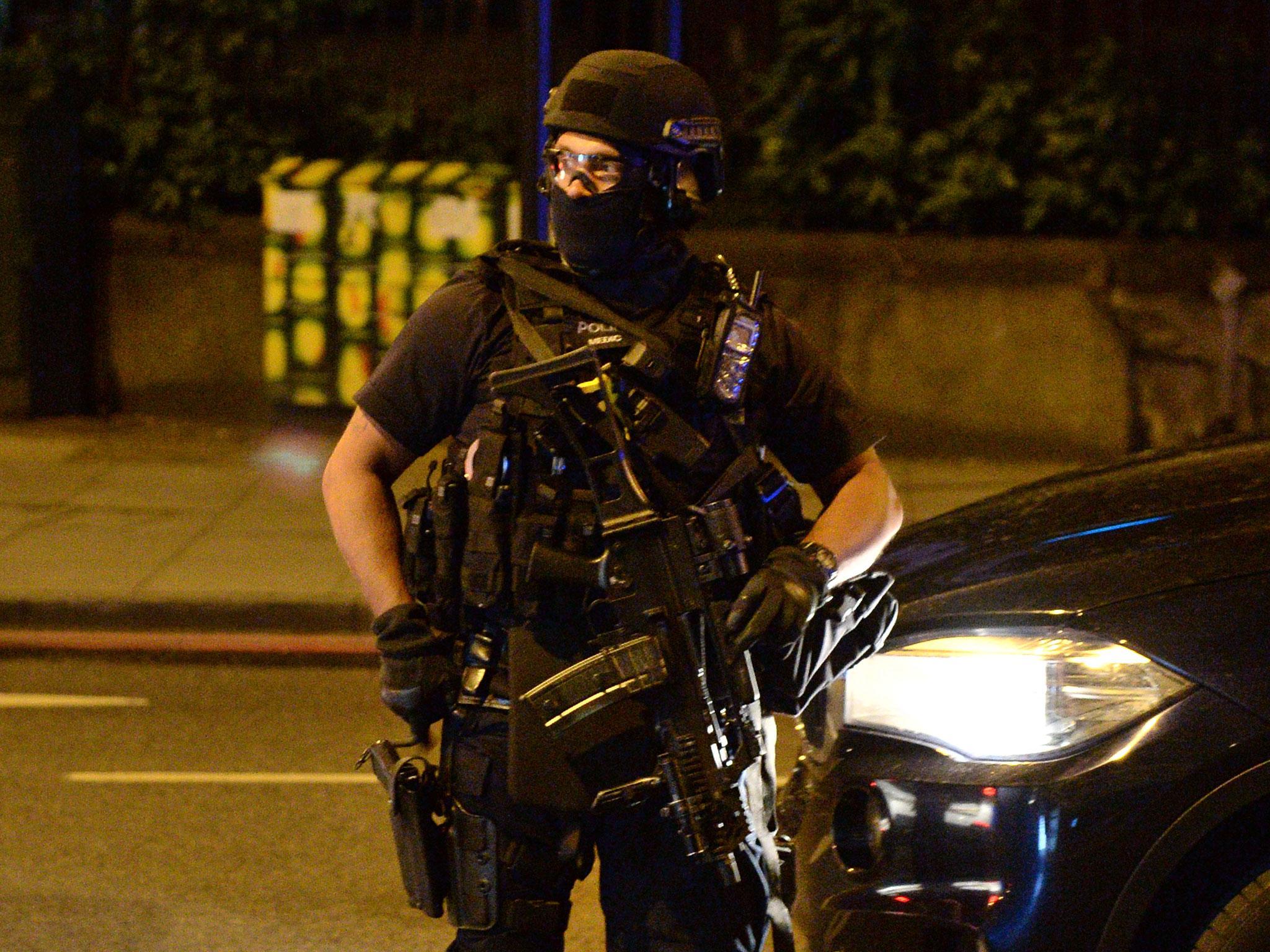 An armed officer attends the scene in 2017