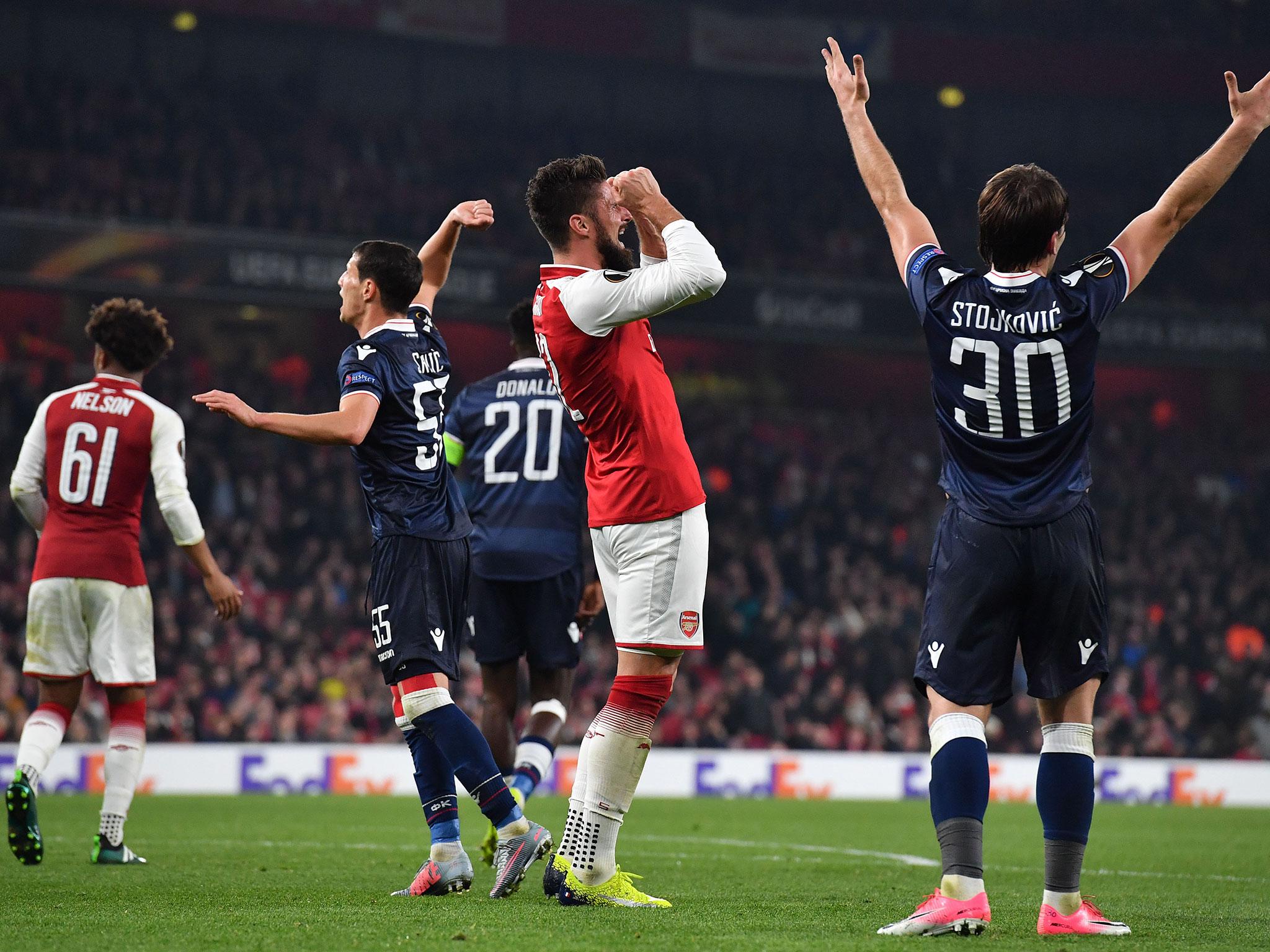 Giroud reacts after squandering a chance in front of goal (Getty)