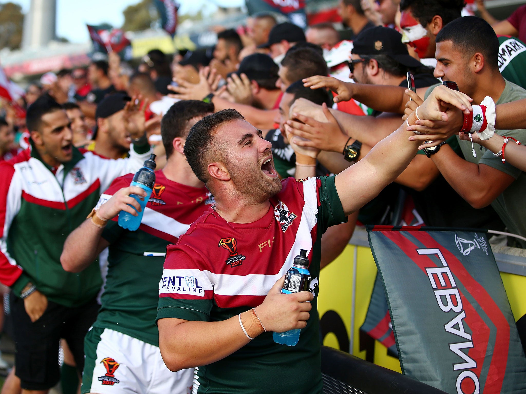 Lebanon's players celebrate with fans after beating France