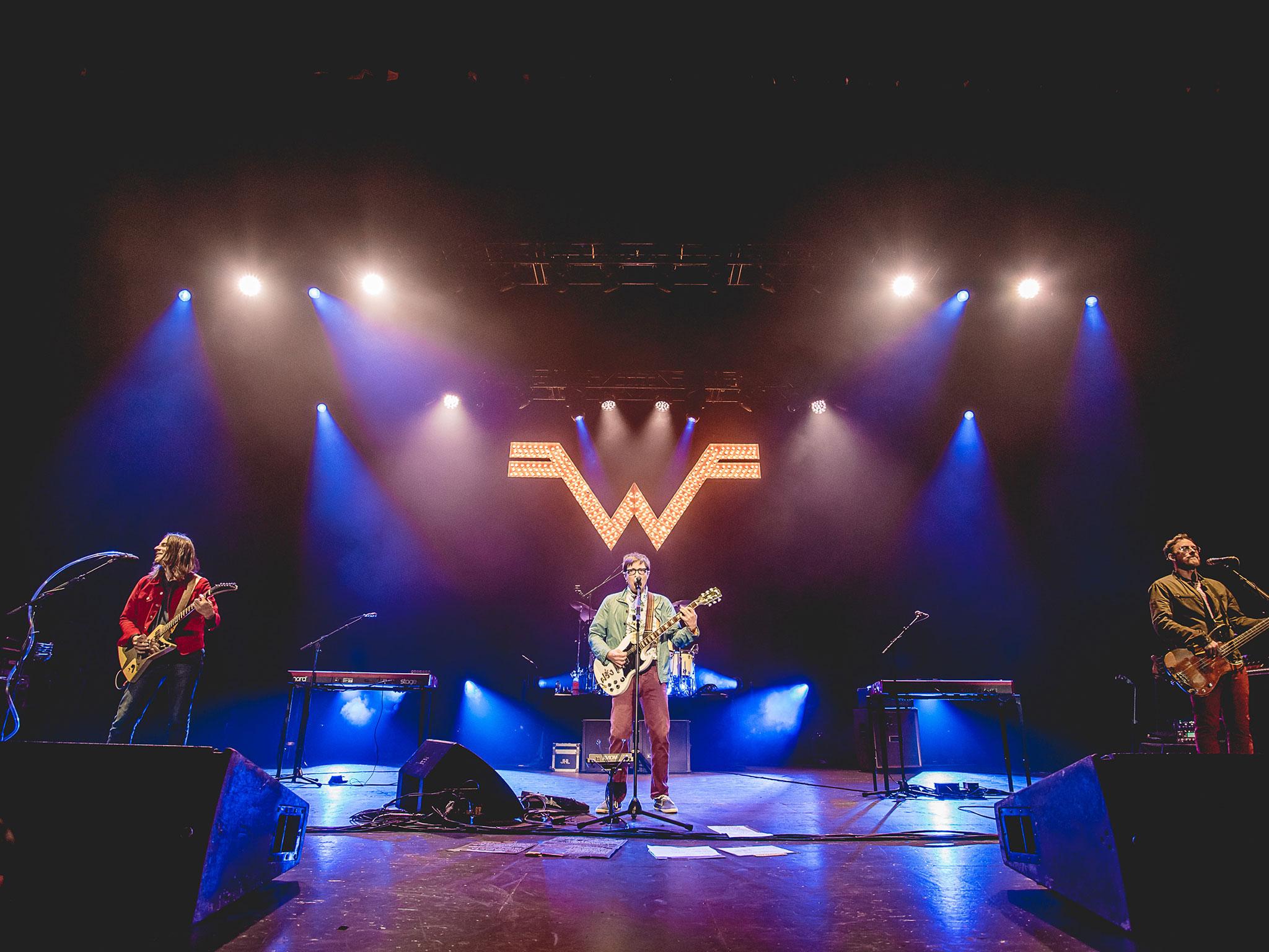 Brian Bell, Rivers Cuomo and Scott Shriner of Weezer