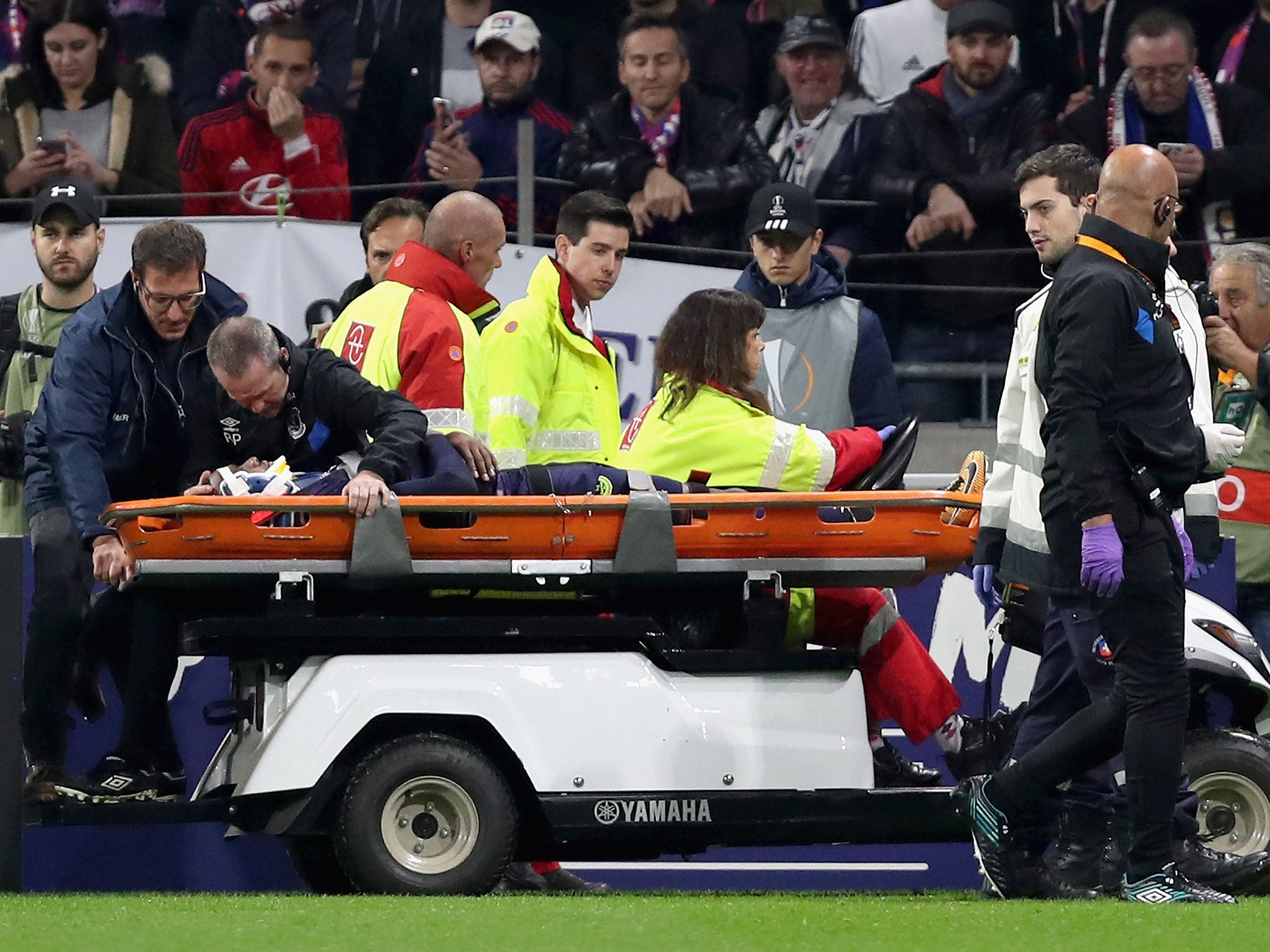 Cuco Martina is stretchered off after suffering a heavy fall against Lyon last night